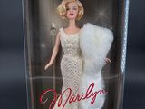 the barbie doll is in a box with a fur stoler on it