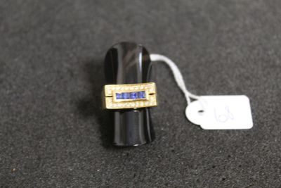 a ring with a blue stone on it and a price tag on it