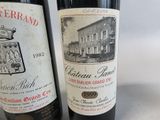 two bottles of wine sitting next to each other on a table