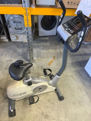 a stationary exercise bike with a cell phone on top of it