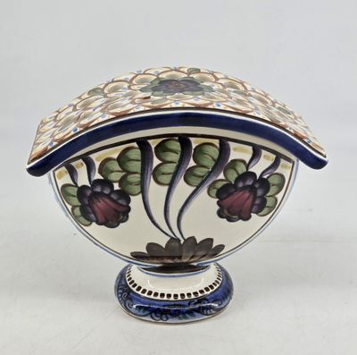 an image of a decorative bowl with a lid