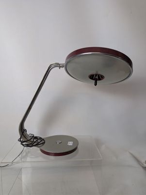 a lamp that is sitting on a clear table