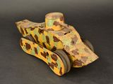 a wooden toy car that has a camouflage pattern on it