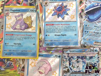 several pokemon cards are on a table with a lot of other pokemon cards