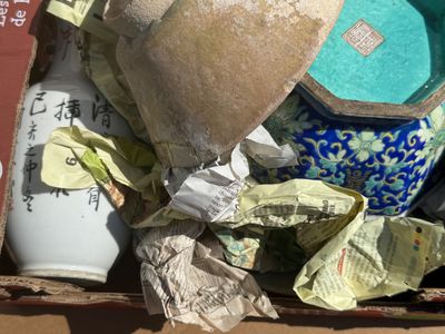 a box full of vases and other items in it