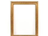 a gold picture frame on a white wall with a white background