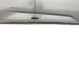 a picture of a car with the door open and a person standing in front of it