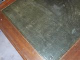 a table with a glass top that has flowers on it