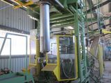 a picture of a machine that is working on a piece of machinery