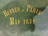 a close up of a green book with gold writing on it
