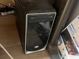 a computer that is sitting on the floor next to a wall