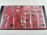 a red binder with a lot of coins on it