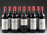 six bottles of red wine lined up in a row