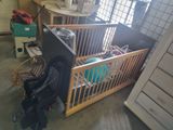 a baby crib that is in the middle of a room