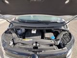 a car with its hood open and the engine in the trunk