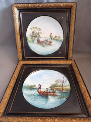 two framed pictures of a couple of people in a boat on a lake
