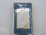 a close up of a box of perfume on a white surface