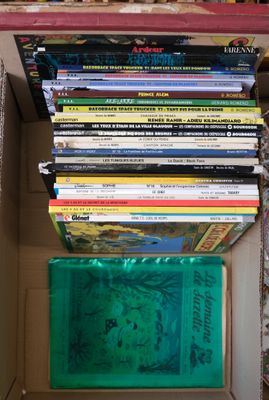 a box full of books sitting on a table