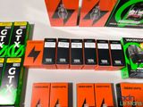 several boxes of electronic gadgets sit on a table next to each other