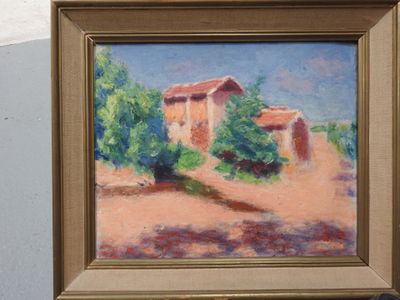 une photo d'un tableau représentant une maison accrochée à un mur