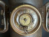 a close up view of a fire hydrant with a clock on it