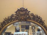 a mirror that is sitting on a wall in a room
