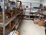 a room with a lot of boxes on the shelves