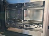 a stainless steel microwave with a glass door on it