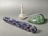 three glass items that are sitting on a table