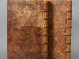 an old book with a brown leather cover and two brown leather bindings