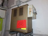 a box with a red sticker on it in a room