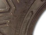 a close up of a tire on a white background