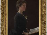 a painting of a woman reading a book in a gold frame