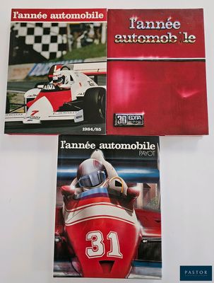three books on a table with a racing car in front of them