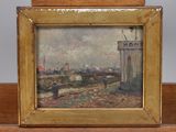 an oil painting of a cityscape in a wooden frame on a shelf