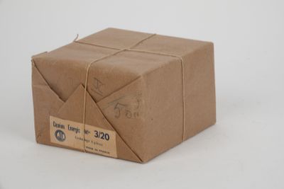 a brown box that is wrapped in brown paper