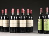 several bottles of wine are lined up on a table