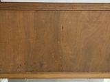 a picture of a wooden cabinet in a room
