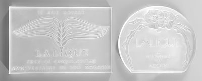 a close up of a plaque with a flower on it