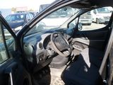 a car with the door open sitting in a parking lot