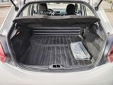 the back of a car with the trunk open and a tray in the trunk