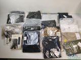 a lot of clothes that are sitting on a table