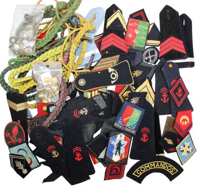 a pile of military patches and badges on a white background