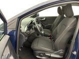 the interior of a car with the door open and the driver ' s seat down