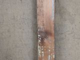 a piece of wood that has some paint on it