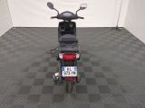 a motor scooter that is parked in a garage