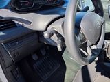 dashboard view of a car with a steering wheel and dashboard controls