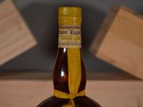 a bottle of liquor that is sitting on a table