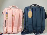 two backpacks sitting next to each other on a table