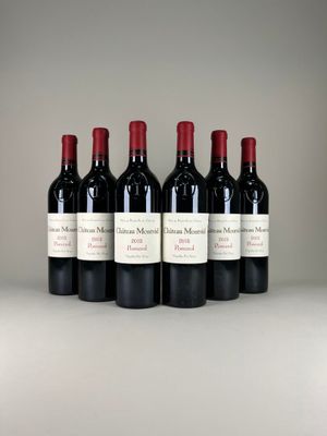 six bottles of red wine lined up in a row on a table